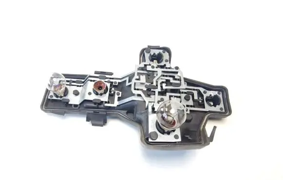Tail light bulb cover holder