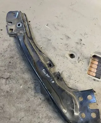 Top upper radiator support slam panel