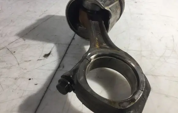 Piston with connecting rod