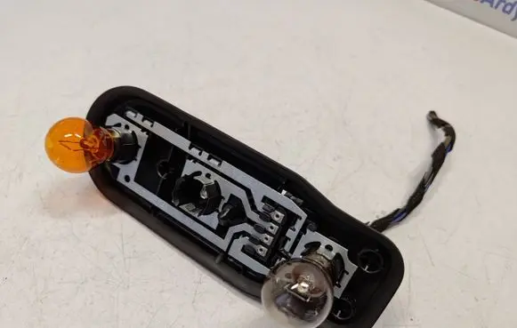 Tail light bulb cover holder