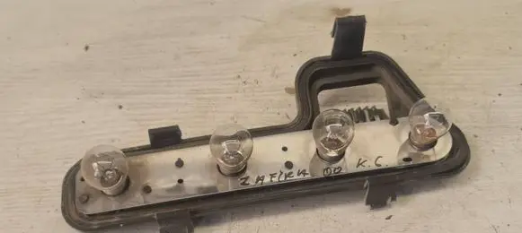 Tail light bulb cover holder