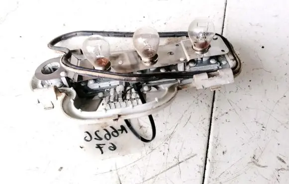 Tail light bulb cover holder