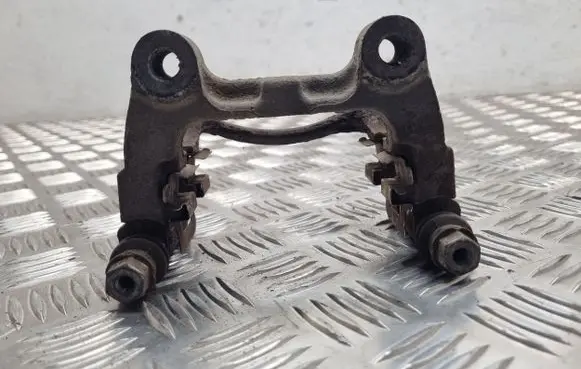 Volkswagen PASSAT B6 Brake caliper pad carrier rear 