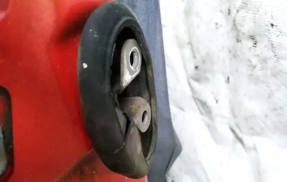 Front door check strap stopper