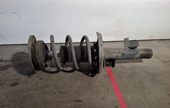 Front shock absorber with coil spring