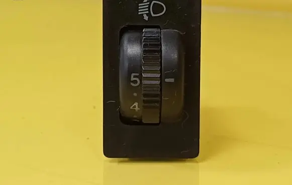 Headlight level height control switch