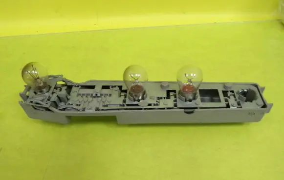 Tail light bulb cover holder