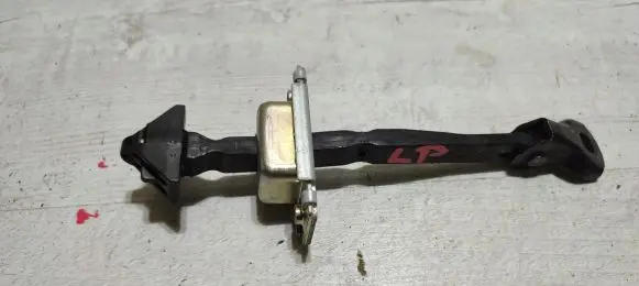 Front door check strap stopper