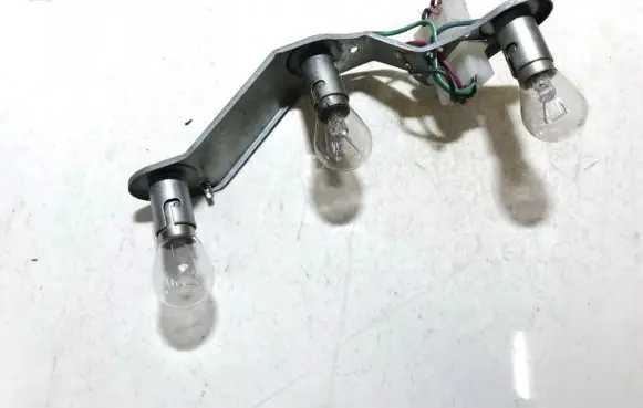 Tail light bulb cover holder