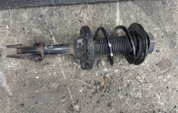 Subaru Legacy Front shock absorber with coil spring