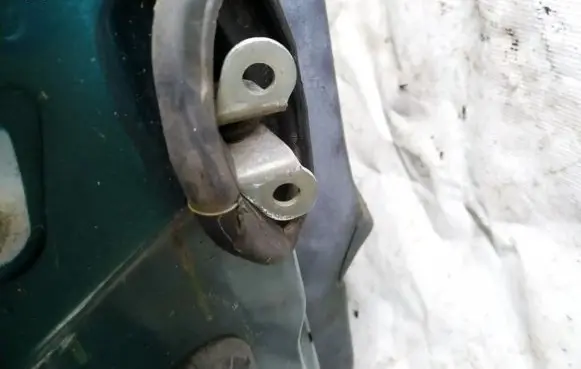 Front door check strap stopper