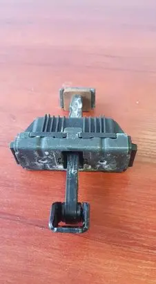 Front door check strap stopper