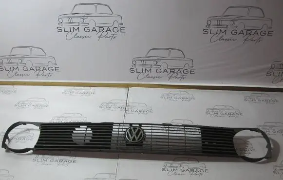 Volkswagen Polo II 86C 2F Front bumper upper radiator grill 867853653