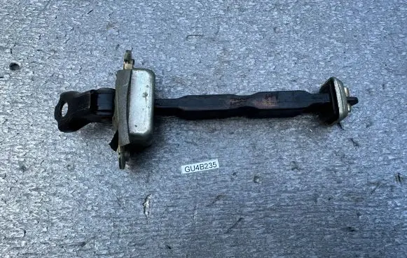 Front door check strap stopper