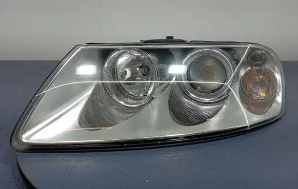 Volkswagen Touareg I Headlight/headlamp 08-341-1119L