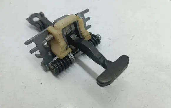 Front door check strap stopper