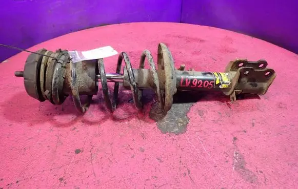 Front shock absorber with coil spring