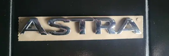 Opel Astra J Rear door emblem/model letters 90510602