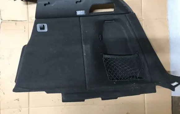 Trunk/boot lower side trim panel