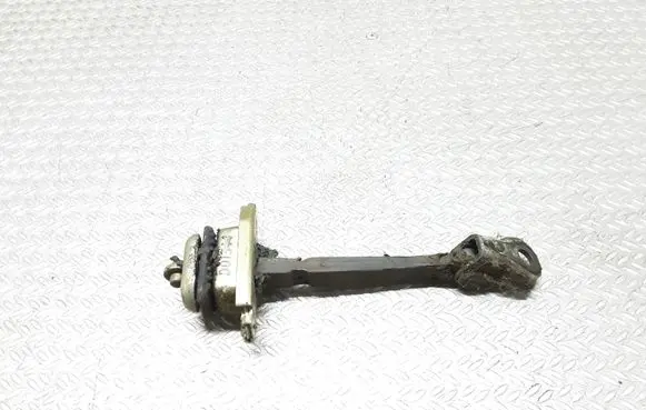Front door check strap stopper