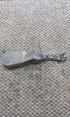 Front door check strap stopper