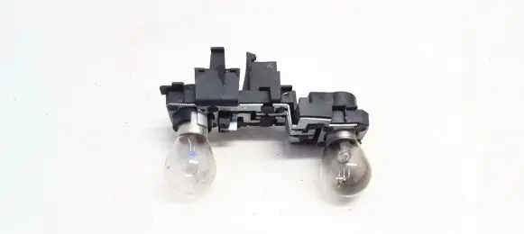Tail light bulb cover holder