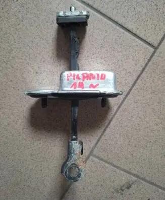 Front door check strap stopper