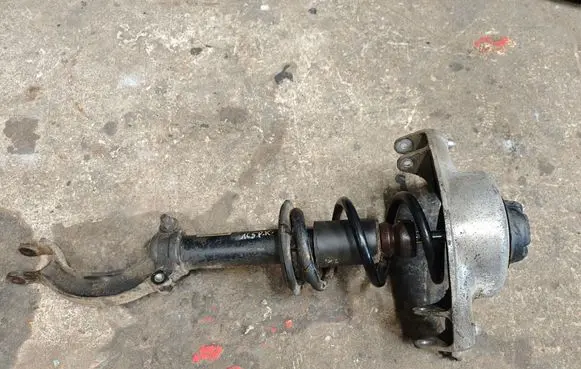 Front shock absorber with coil spring