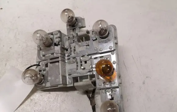 Tail light bulb cover holder