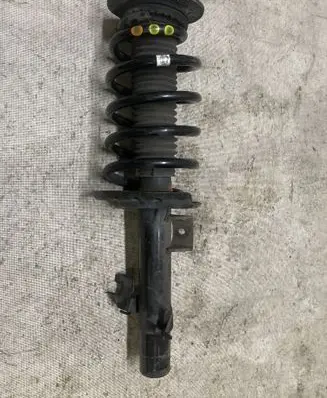Front shock absorber with coil spring