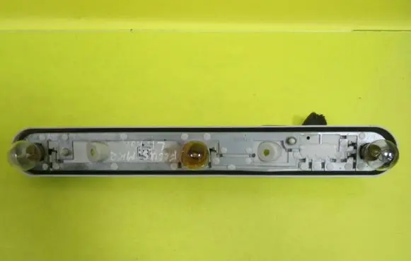 Tail light bulb cover holder