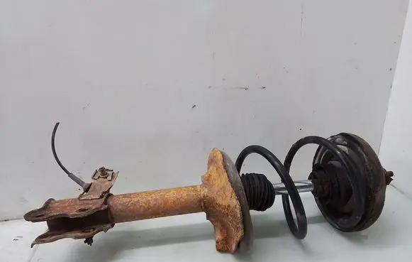 Nissan X-Trail T30 Front shock absorber with coil spring