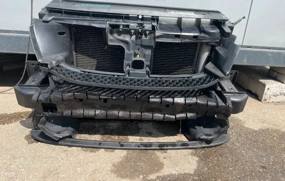 Radiator support slam panel
