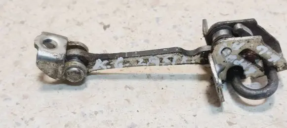 Rear door check strap stopper