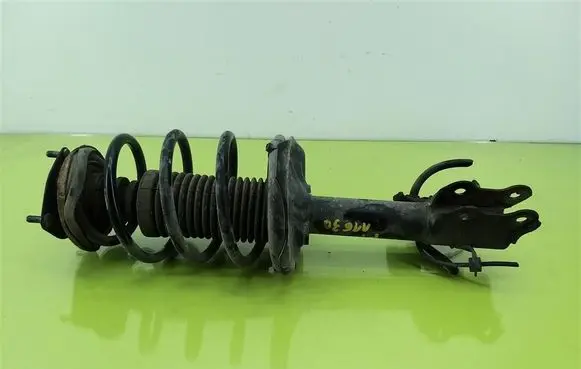 Nissan Almera N16 Front shock absorber with coil spring
