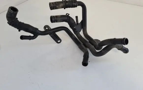 Volkswagen Golf VII Engine coolant pipe/hose 04L121064AF