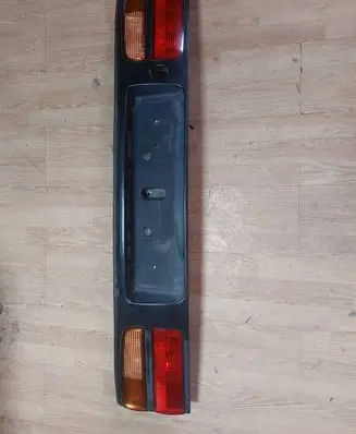 Trunk door license plate light bar