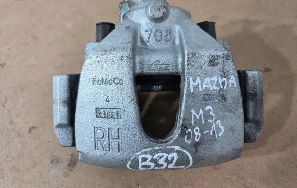 Mazda 3 II Front brake caliper 706