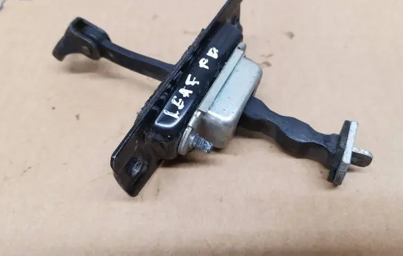 Nissan Leaf I (ZE0) Front door check strap stopper 
