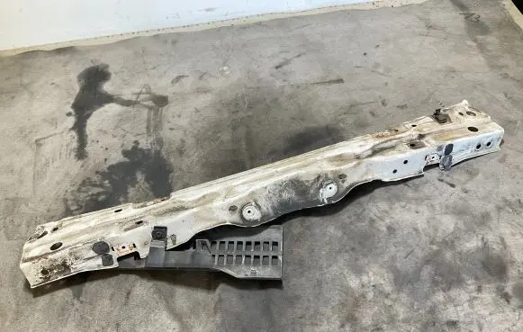 Top upper radiator support slam panel