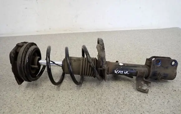 Nissan Micra Front shock absorber with coil spring 