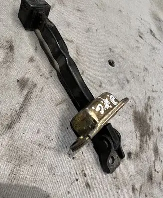 Mitsubishi Pajero Rear door check strap stopper