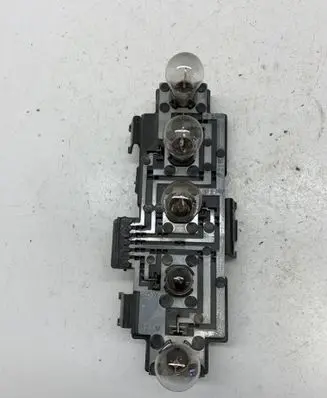 Tail light bulb cover holder