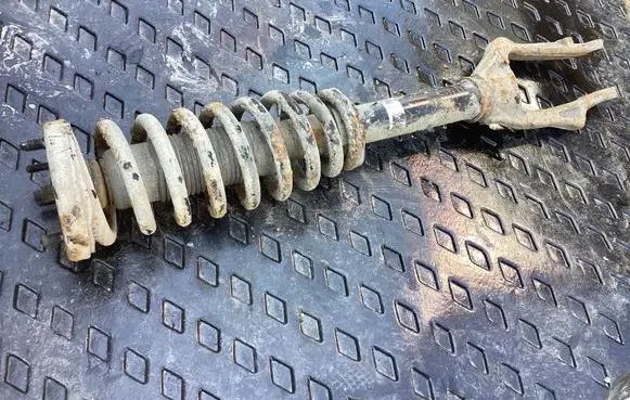 Front shock absorber with coil spring