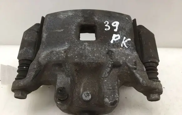 Nissan Juke I F15 Front brake caliper 