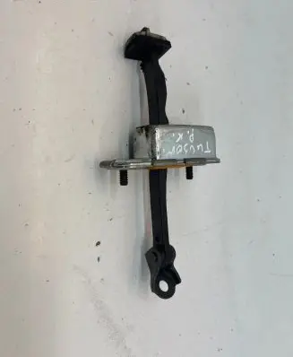 Front door check strap stopper
