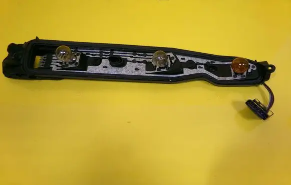 Tail light bulb cover holder