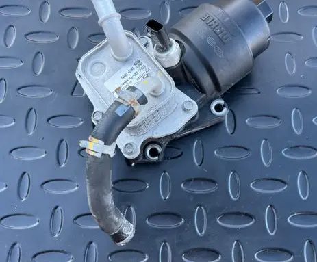 Hyundai Tucson IV NX4 Oil filter mounting bracket 264102MHAO 263002MHAC
