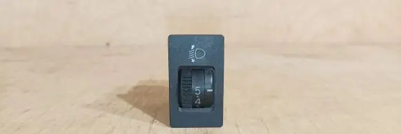 Headlight level height control switch