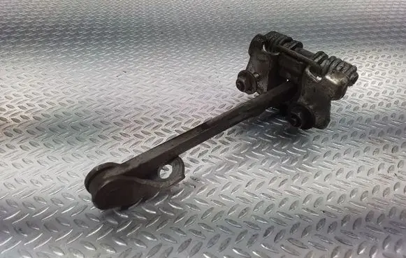 Front door check strap stopper